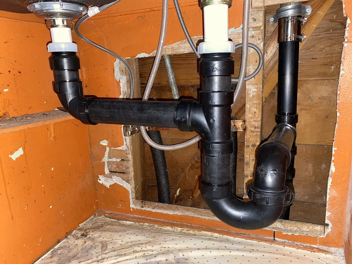 Professional Garbage Disposal Repair equipment and tools on the job in Clayton